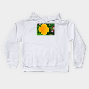 Yellow flower close-up against blurry green background Kids Hoodie